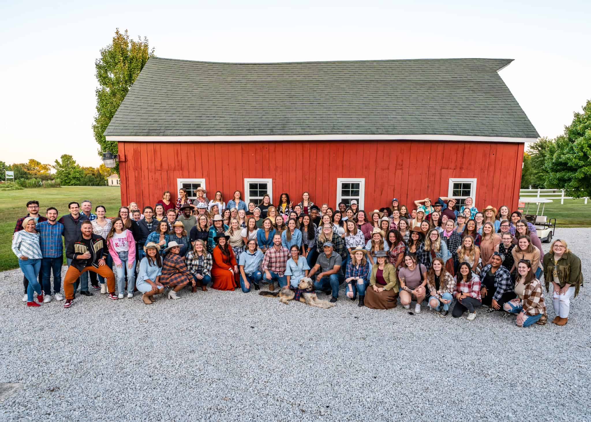 K1ds Count Therapy staff group photo in front of a red barn